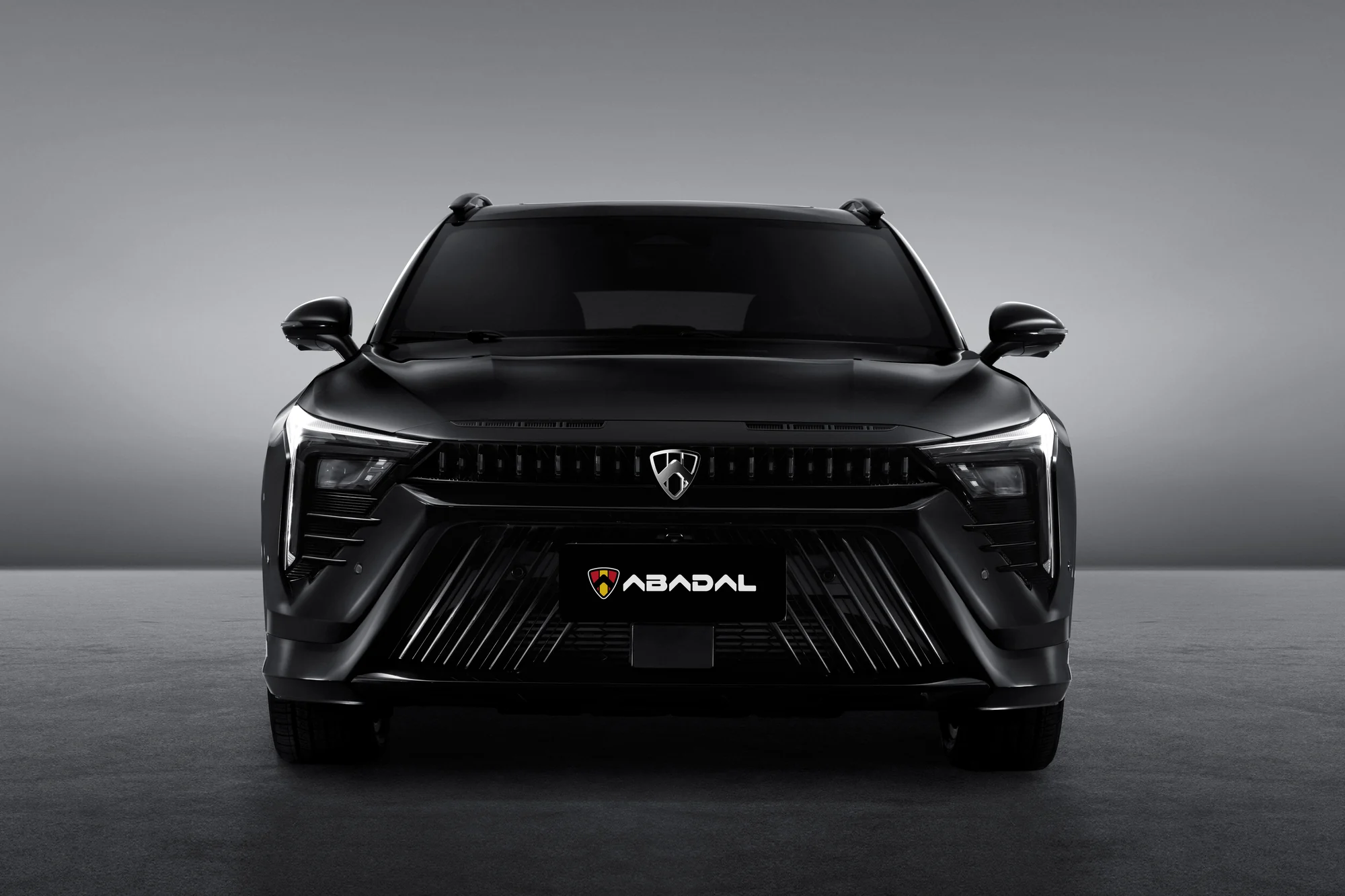 Black ABADAL NOVO head-on in the studio with daytime running lights on
